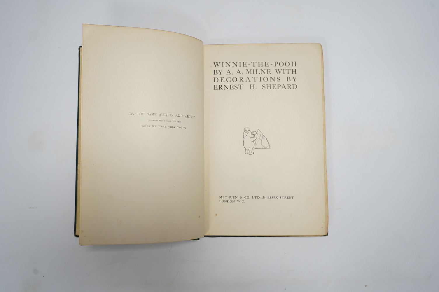 Milne, A.A. - Winnie-The -Pooh. With decorations by Ernest H. Shepard. First Edition. title and text illus. throughout and pictorial map on e/ps.; original gilt ruled and pictorial green cloth (rebacked with old spine la